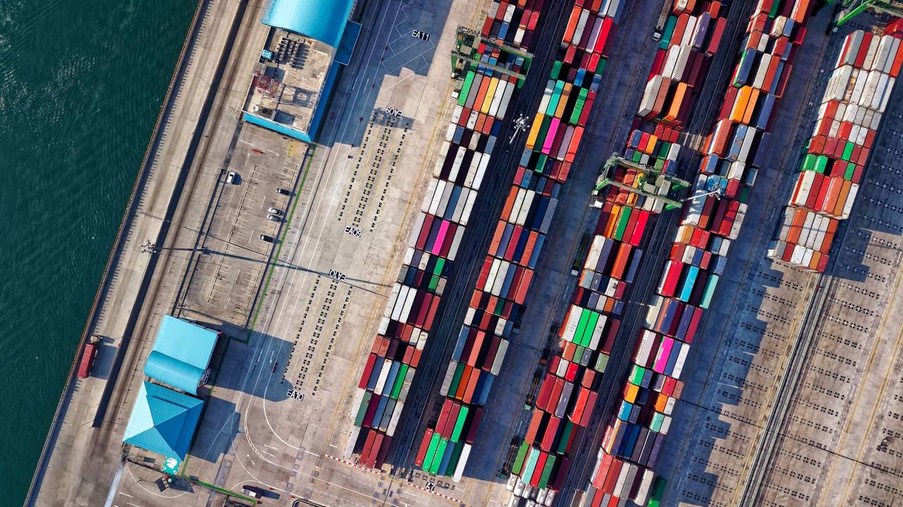 Aerial view of stacked shipping containers at a port in Jakarta